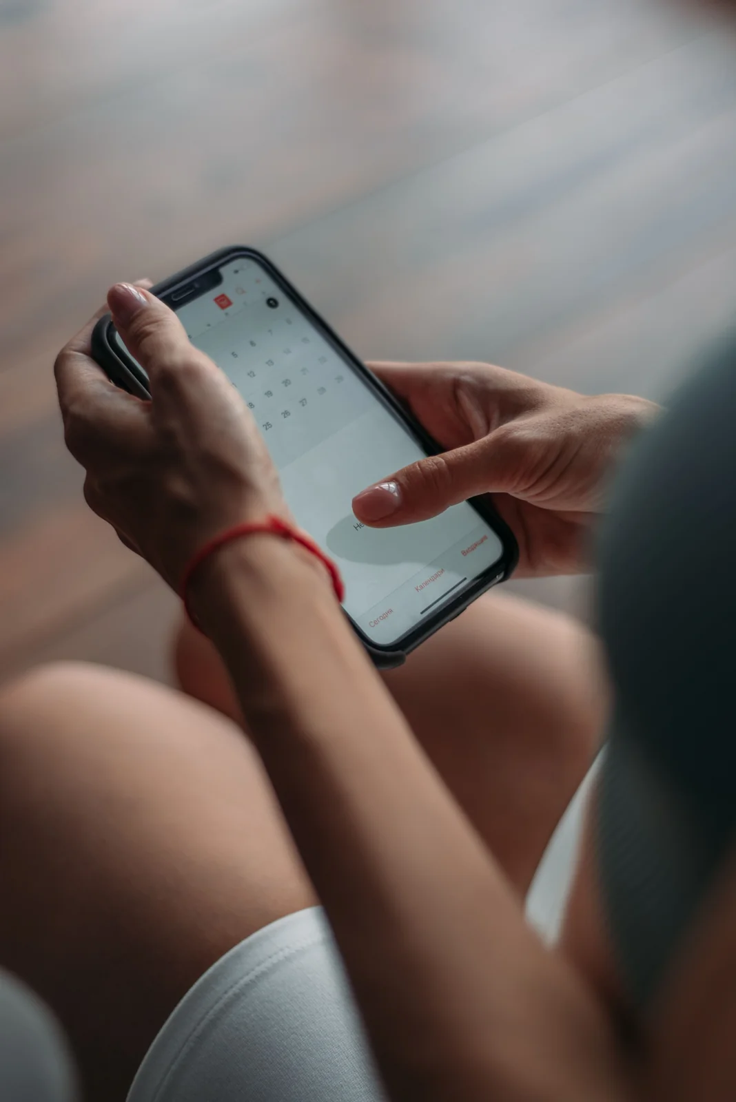 Person checking a calendar application on a smartphone